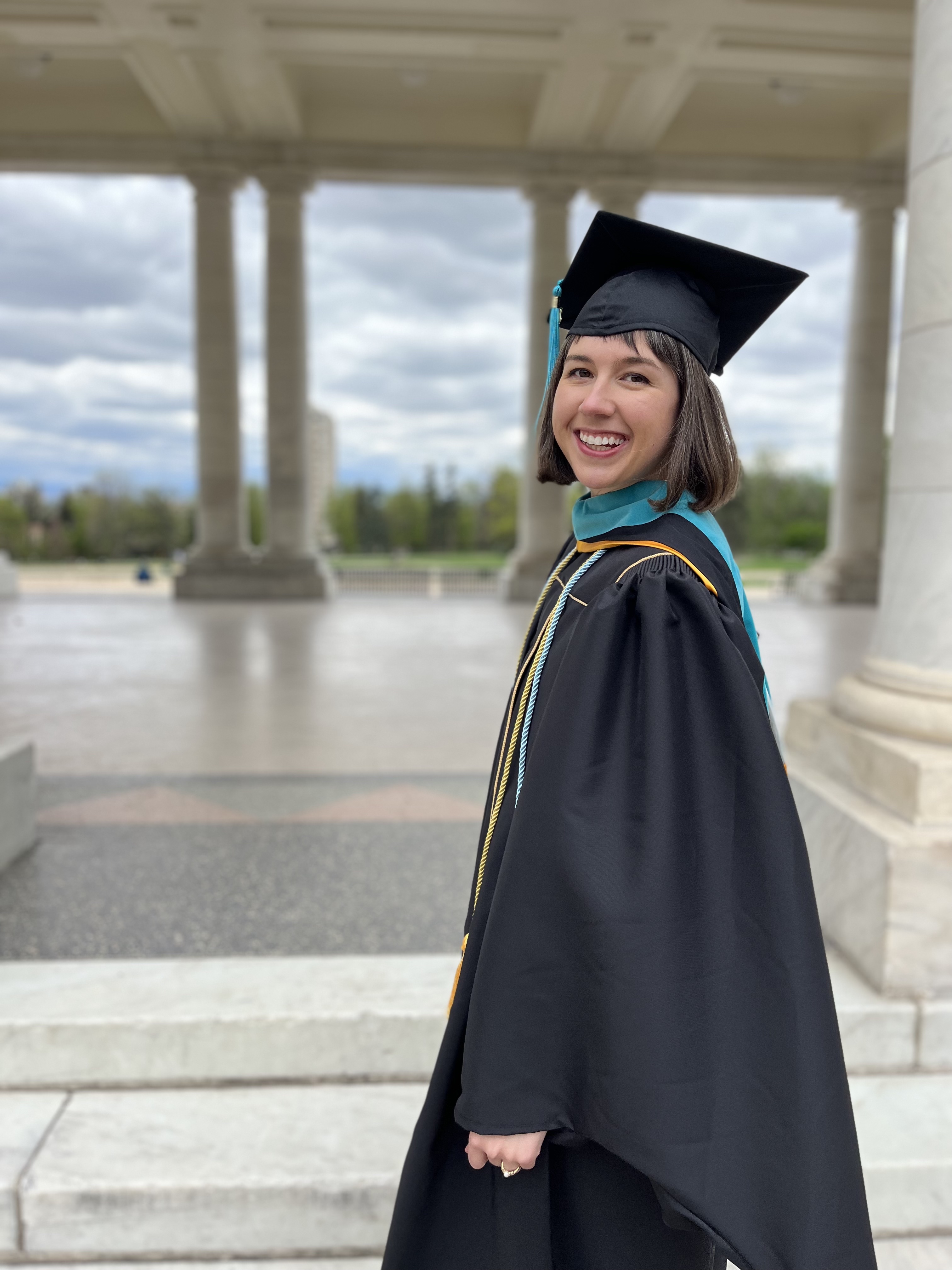 woman wearing cap and gown for graduation