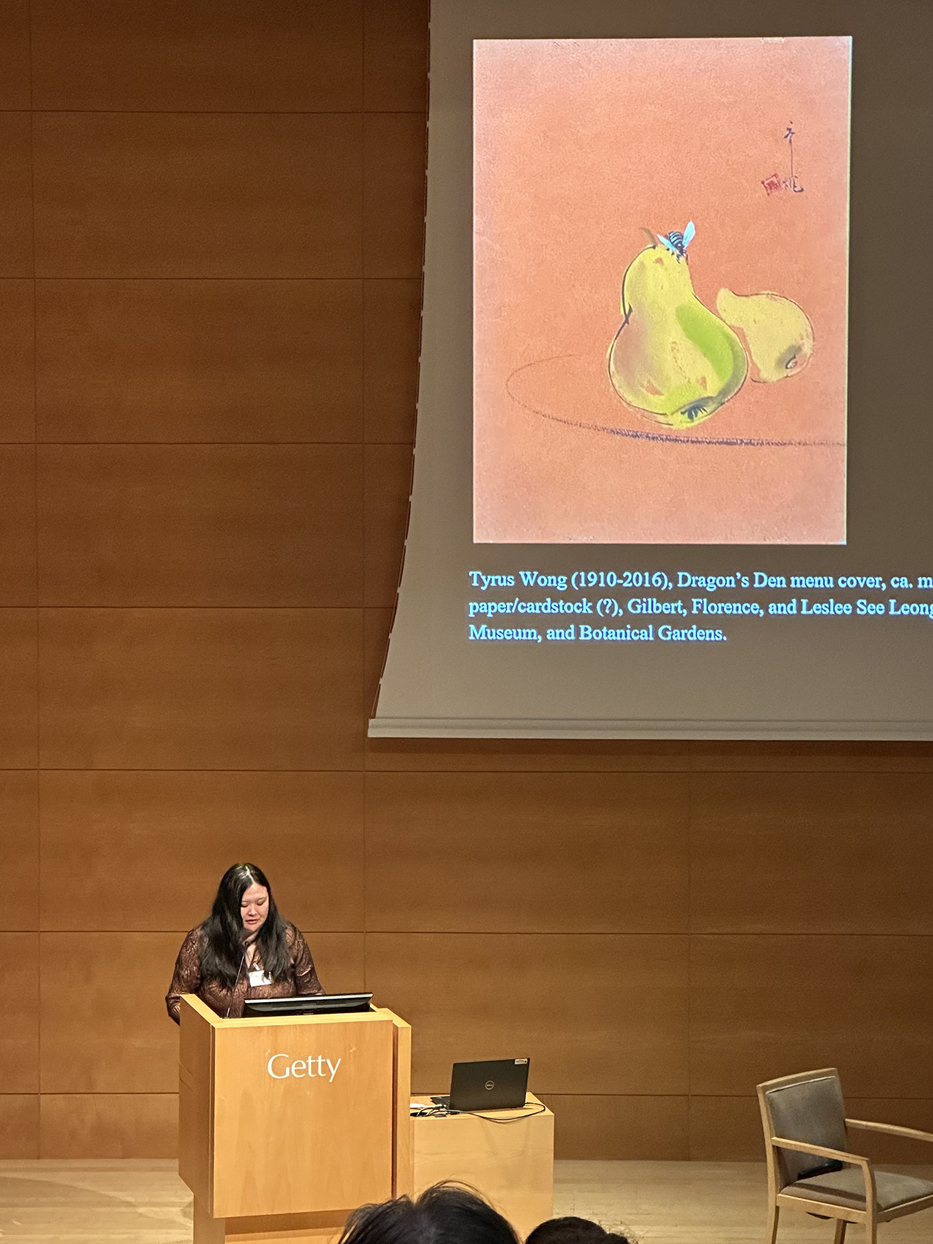 Natalie Zhang presenting her paper, "Murals and Menus: Artistic Community and Cultural Negotiation at the Dragon's Den Restaurant, Los Angeles," at the 7th annual Getty Graduate Symposium, February 7th, 2025.
